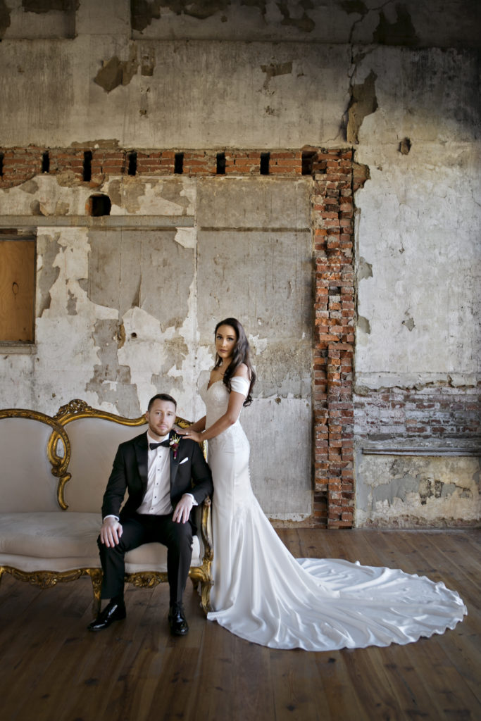 Groom and groom on couch