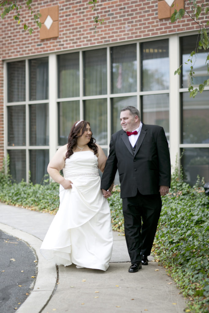 Bride and groom holding hands